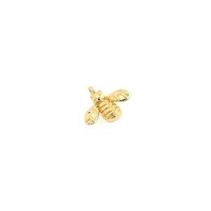 Detailed macro view of 18K gold plated bee charm pendant with polished finish and fine details