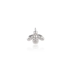 Detailed macro view of 18K gold-plated bee pendant with intricate silver metallic texture