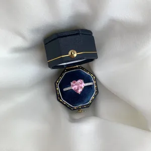 S925 silver ring featuring a pink heart stone inside an octagonal blue velvet jewelry box