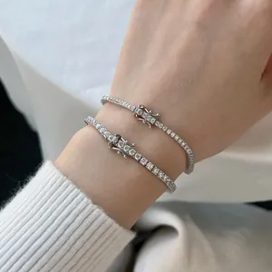Detailed view of two S925 sterling silver tennis bracelets with sparkling white zircons