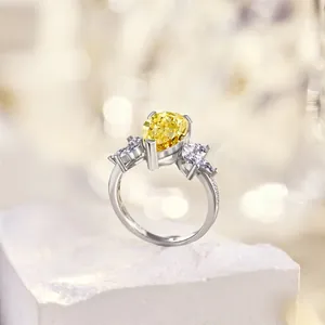 Macro shot of S925 silver ring featuring a pear-cut yellow zircon and side diamond accents