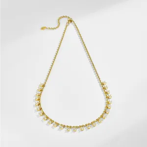 Macro detail of 18K gold-plated S925 silver necklace with square cubic zirconia settings