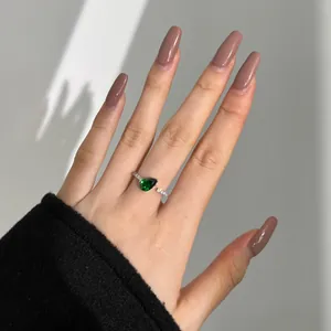 Elegant S925 sterling silver open ring featuring a pear-shaped green zircon centerpiece