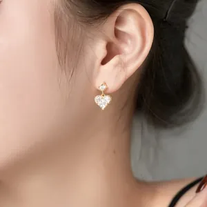 Elegant 925 sterling silver heart-shaped drop earrings with square zircon on model