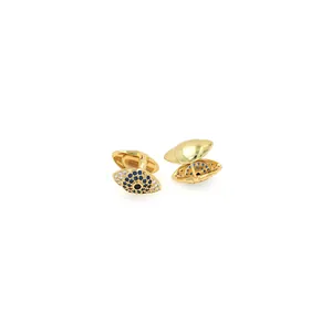 Detailed view of evil eye cufflinks with blue zircons and folding back mechanism