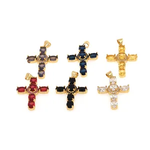 Macro shot of colorful 18K gold plated cross pendants with micro paved zircons detail