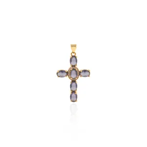 Detailed view of 18K gold plated cross pendant with oval zircons and micro-pave setting