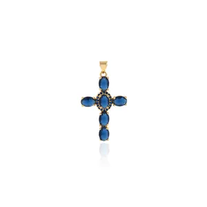 Close-up of 18K gold plated cross pendant featuring six oval blue sapphire zircons