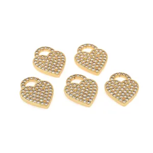 Close-up of five heart-shaped 18K gold-plated pendants with cubic zirconia inlay