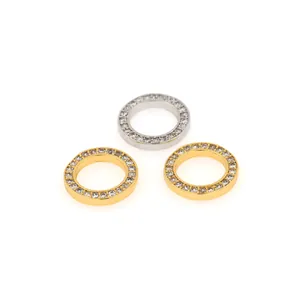 Close-up of geometric circular 18K gold and silver plated pendants with pavé set cubic zirconia