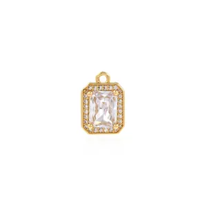 Detail view of 18K gold plated pendant with emerald cut zircon and micro-pave crystals