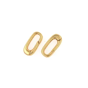 Detail of two 18K gold-plated oval carabiner spring clasps for jewelry making