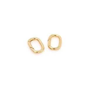Close-up of 18K gold-plated oval carabiner spring clasps for DIY jewelry making