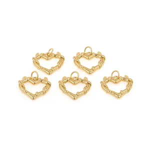 Detailed close-up of 5 gold-plated heart charms with twisted texture for DIY jewelry