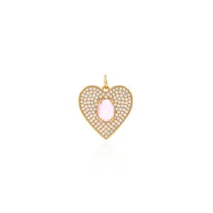 Macro view of 18K gold plated heart pendant with pink oval stone and zircon stones