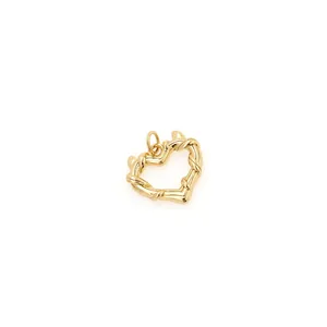 Macro shot of 18K gold-plated heart pendant with twisted rope texture and hollow design
