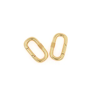 Close-up of polished 18K gold plated oval carabiner clasps for DIY jewelry making