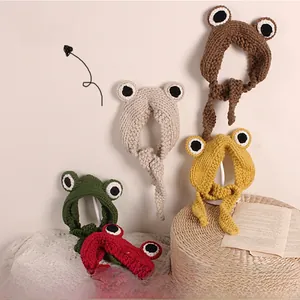 Detail shot of various hand-knitted frog eyes headbands in multiple vibrant colors