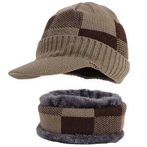 Macro detail of brown checkered knit pattern on winter hat and scarf set with visor