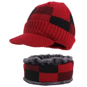 Detailed view of the red and black plaid knitted hat and warm faux fur lined neck warmer
