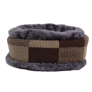 Detail of color-block knit neck warmer with thick grey faux fur lining for winter warmth