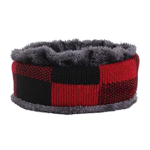 Detail of red and black buffalo plaid snood with thick grey plush lining for winter warmth