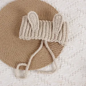 Beige hand-knitted baby rabbit ear headband with tie strings for infants and toddlers