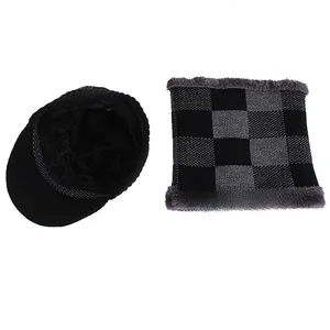Detail of winter knit beanie and scarf set with thick faux fur lining and plaid pattern