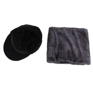 Detail view of winter knitted beanie hat and thick fleece-lined neck warmer set
