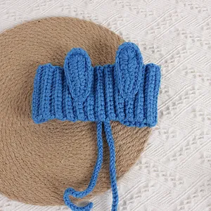 Royal blue hand-knitted baby headband with 3D bunny ears and adjustable tie strap