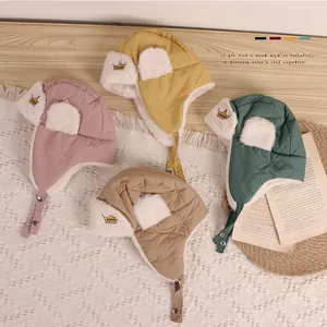 Close-up of baby crown aviator hats with warm fleece lining and adjustable chin straps