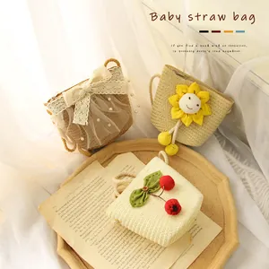 Handmade girl's straw crossbody bags with lace bows, sunflower, and cherry decorations