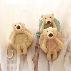 Trois sacs en paille ronds pour enfants avec ours en peluche mignons et bandoulières tressées