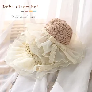 Handmade baby straw hat with elegant lace bow and mesh trim for summer sun protection