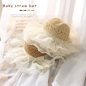 Cute straw baby sun hat with white lace ruffle brim and elegant bow for summer protection