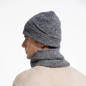 Detailed knit texture of grey marl winter beanie and matching thermal neck warmer set