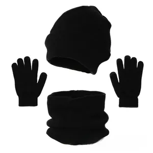 Flat lay of black winter knit set showing hat, gloves with touchscreen tips and neck warmer