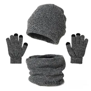 Detailed view of grey knitted set with beanie, infinity scarf, and touchscreen gloves