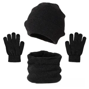 Detailed view of the fine knit texture on the black winter hat, scarf, and gloves set