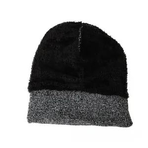 Detail of winter beanie featuring soft black plush lining and grey knit cuff for warmth