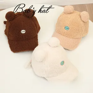 Three lamb wool baby baseball hats in brown, khaki, and beige with cute ear decorations
