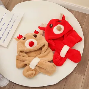 Detail of plush reindeer baby hoods in red and khaki showing soft flannel texture