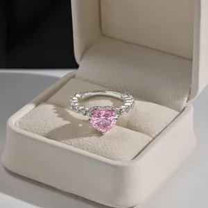 Macro shot of S925 sterling silver stamp on ring with pink heart diamond in velvet box