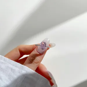 Elegant S925 silver ring with oval pink carbon diamond and pavé side stones on hand