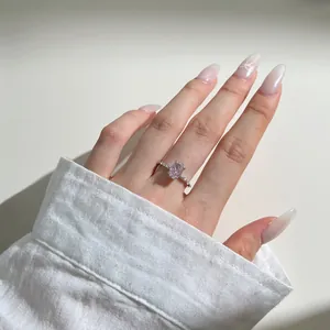 Close-up of elegant S925 silver ring featuring an oval pink zircon on a model's hand