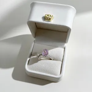 Elegant S925 silver ring with oval pink carbon diamond in a white crown jewelry box