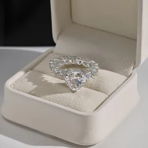 Detail shot of heart-shaped crystal ring in 925 silver with S925 engraving in a box