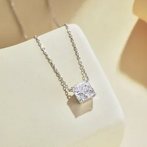 Macro detail of square cut zircon pendant with classic four-prong setting on silver chain