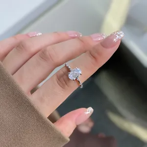 Elegant S925 sterling silver ring with oval cut zircon and side stone accents