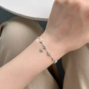 Elegant S925 sterling silver four-leaf flower anklet with sparkling zircon stones for women